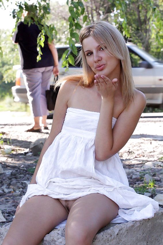 Blonde posing on motorway parking area #1224366