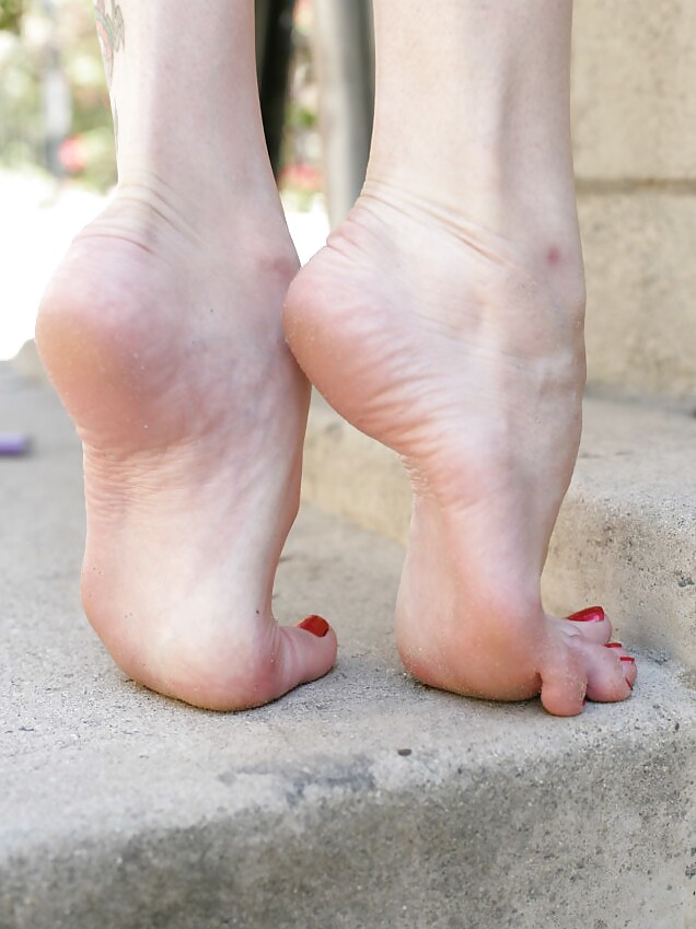 Barefoot Mary with cigarette on the street #5451000