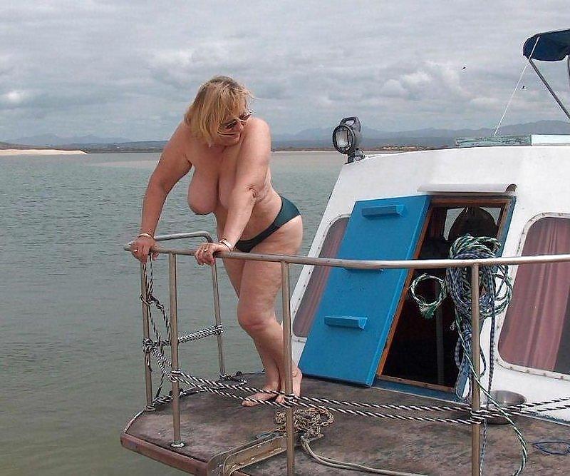 Older women naked at the boat. #3487561
