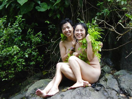 Asian girls at waterfall.
 #6897452