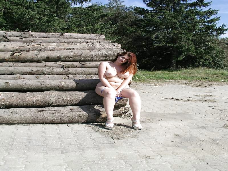 By a stack of logs #22682639