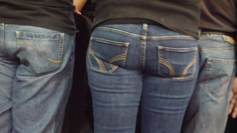 Blue jeans stuffed with rear ends ass & butts