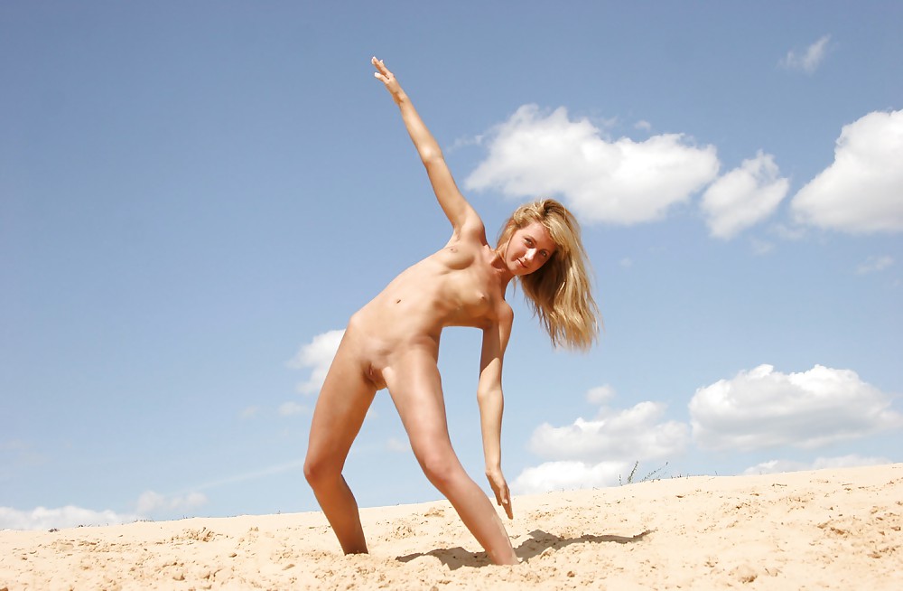 Young blonde plays in the sand #18853281