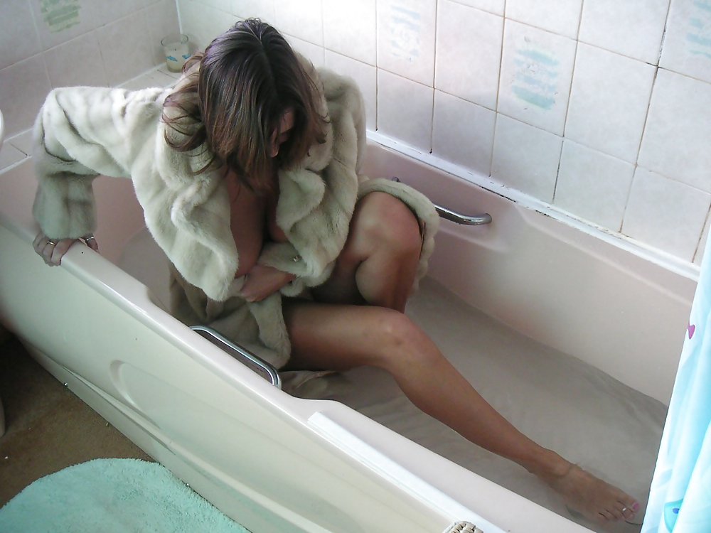 Fur coat in bathtub #3603790