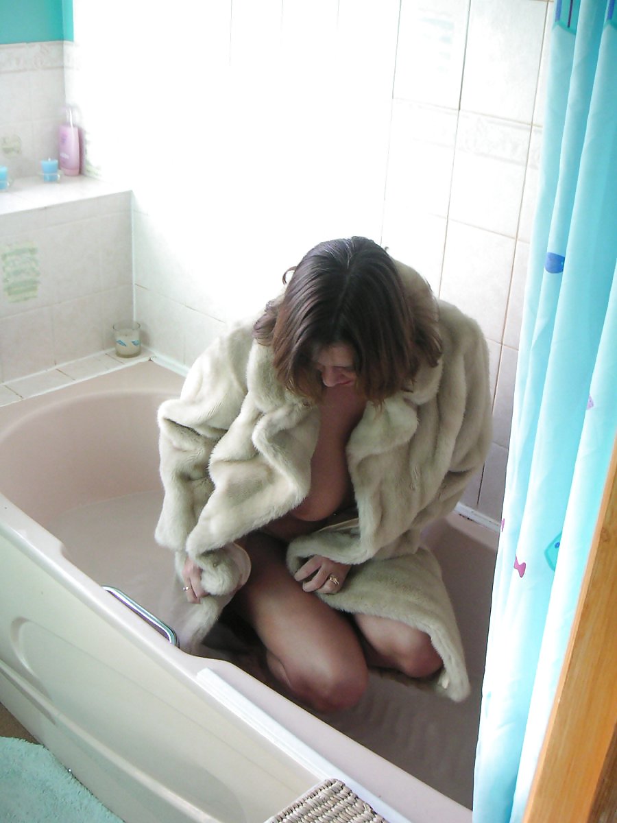 Fur coat in bathtub #3603834