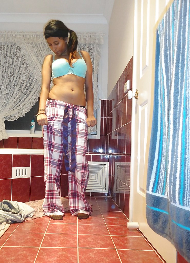 A Pakistani chick stripteasing in bathroom - selfshot #13381869