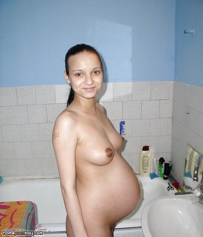 Pregnant lady taking a shower #13140582
