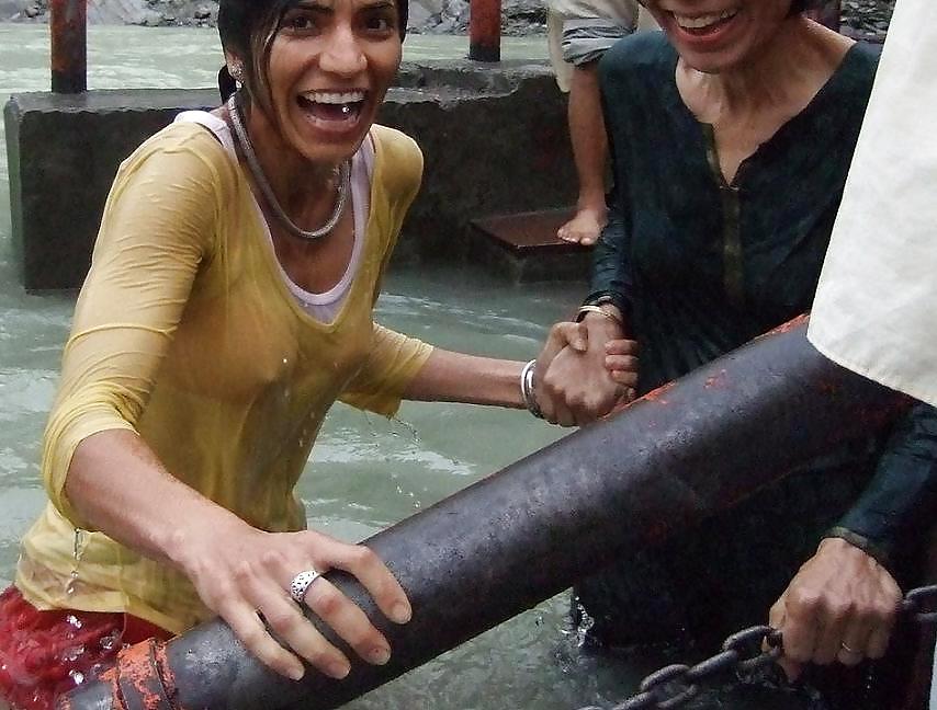 Indian Girls bathing at river ganga  #11575962