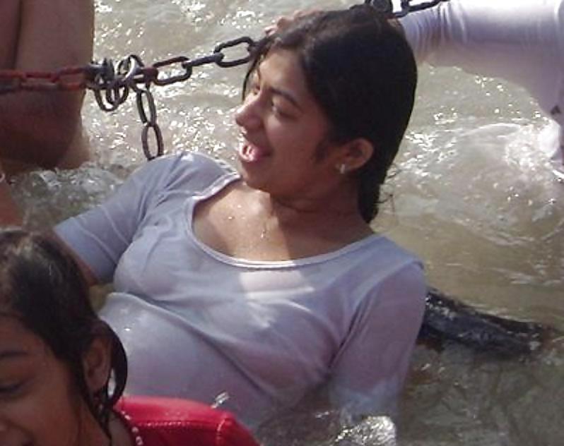 Indian Girls bathing at river ganga  #11575980