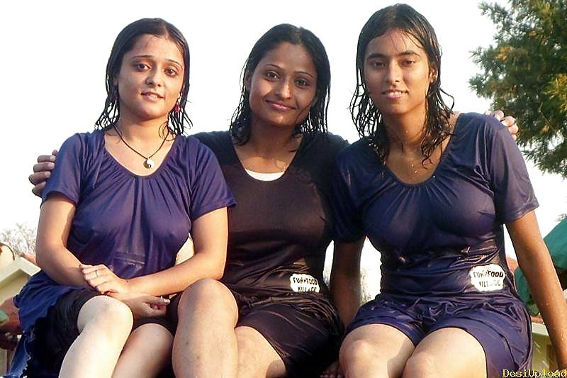 Indian Girls bathing at river ganga  #11575999