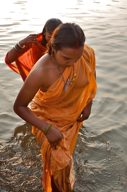 Indian Girls bathing at river ganga  #11576009