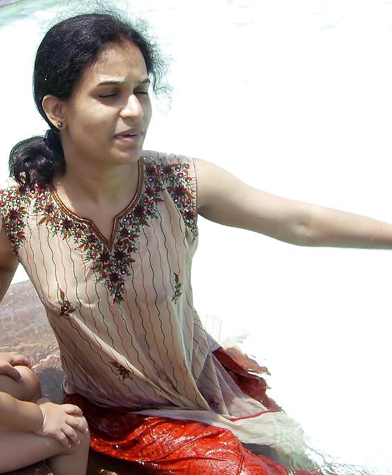 Indian Girls bathing at river ganga  #11576015