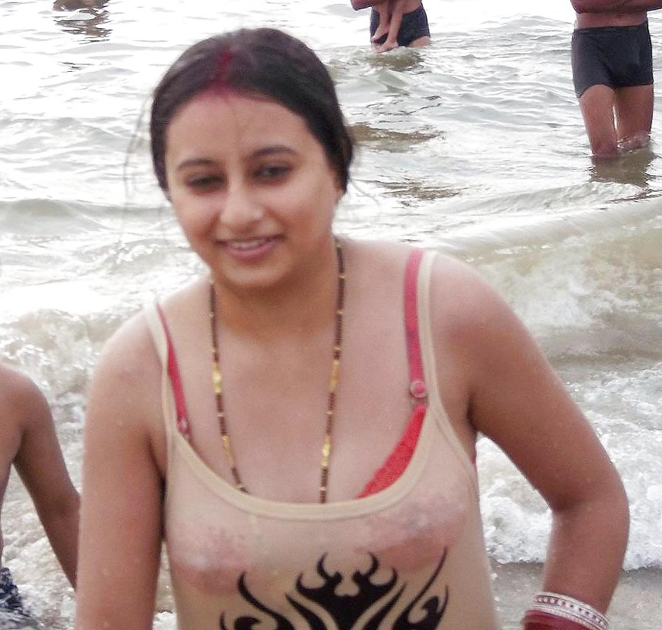 Indian Girls bathing at river ganga  #11576024