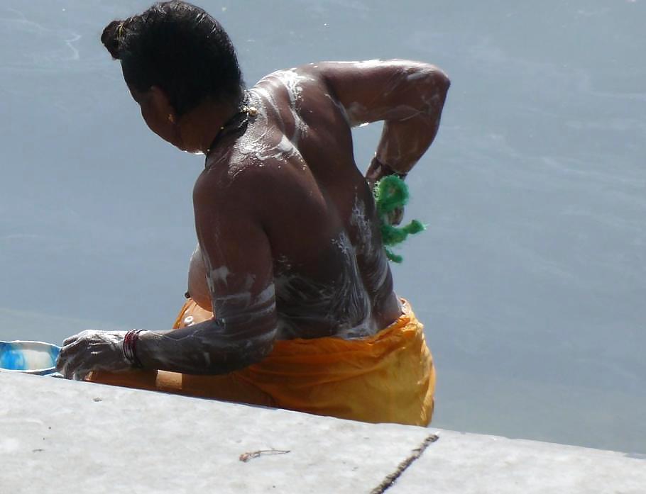 Indian Girls bathing at river ganga  #11576032