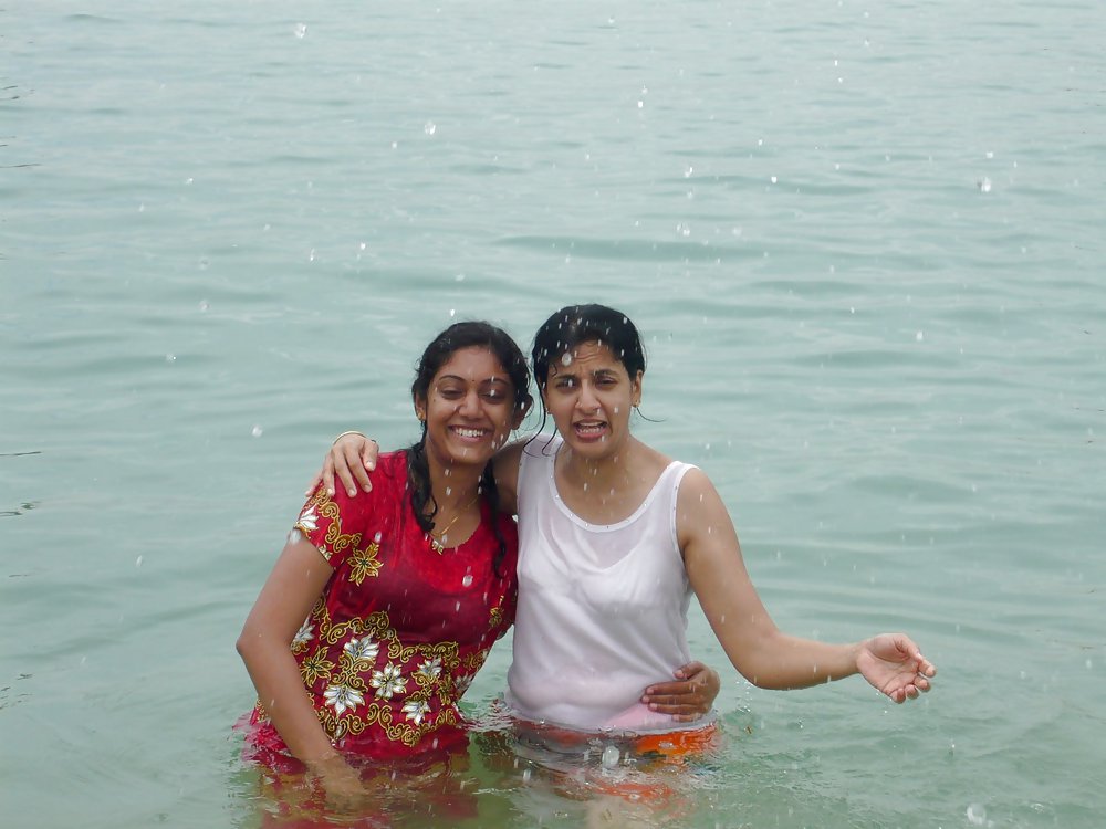 Indian Girls bathing at river ganga  #11576041