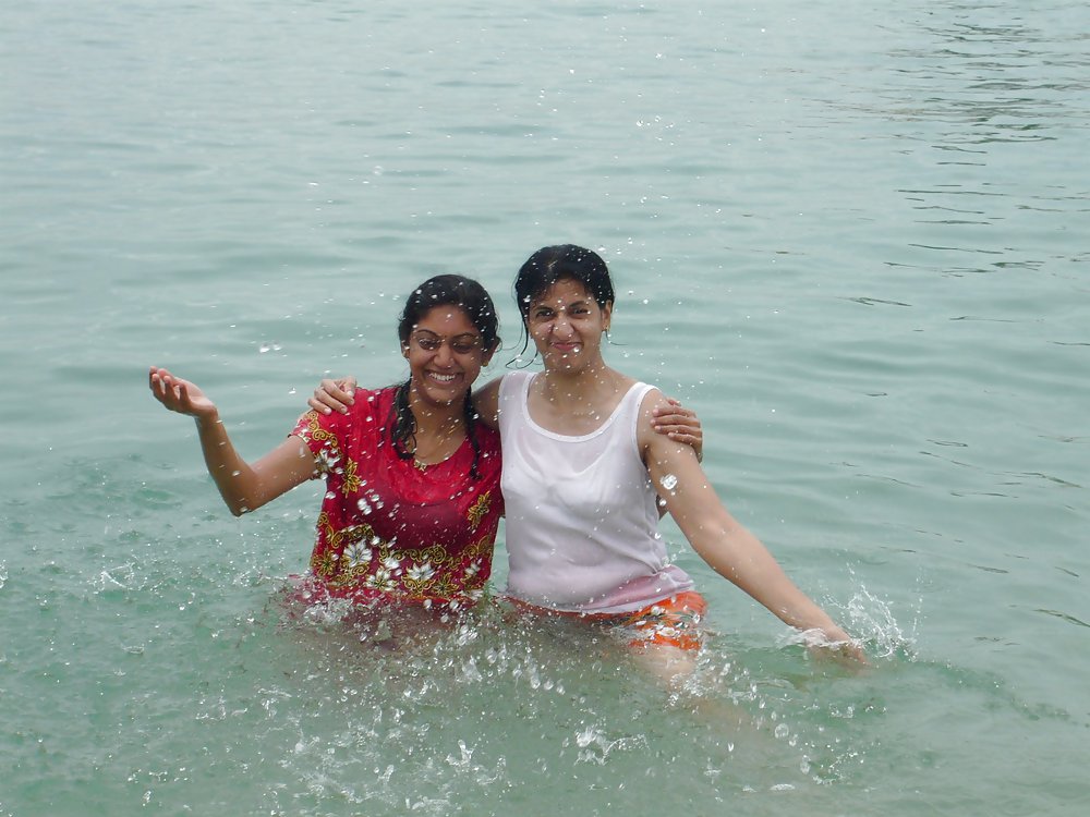 Indian Girls bathing at river ganga  #11576049