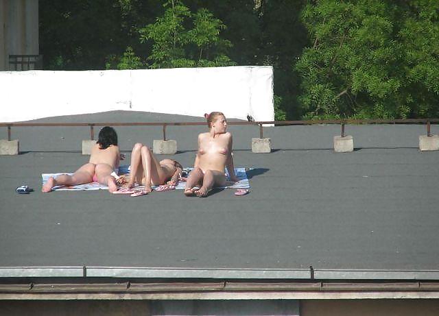 Sunbathing on the roof #15163624