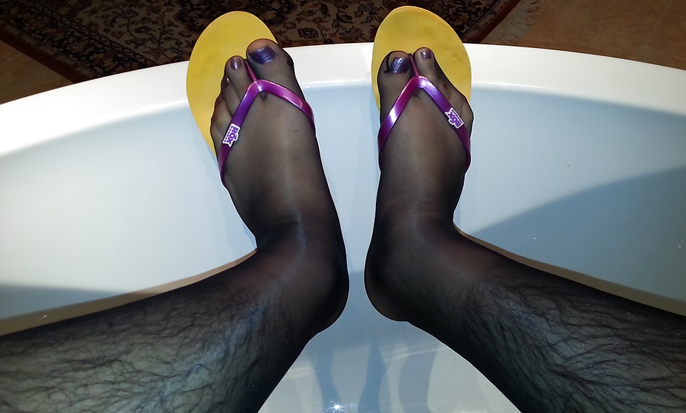 My feet with nylons, polish and my mother's flip flops #21156623
