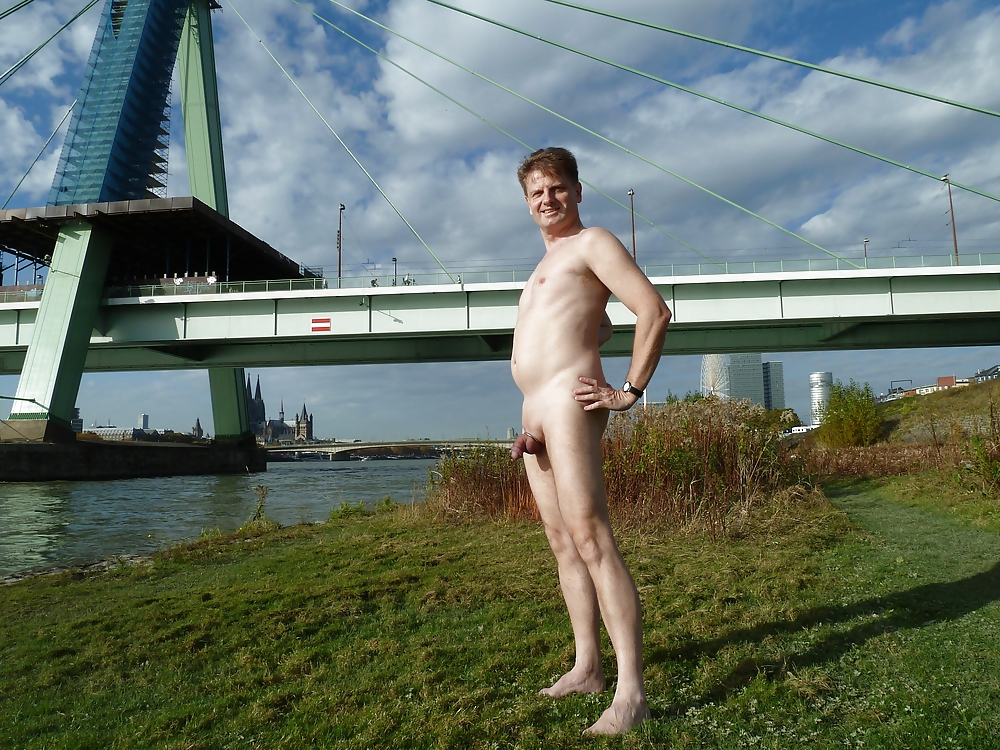 Totalls naked at the river in the city #12320307