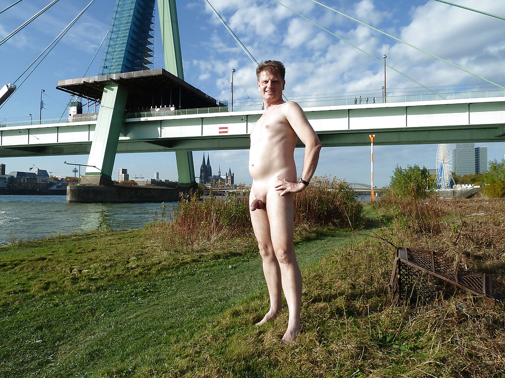 Totalls naked at the river in the city #12320321