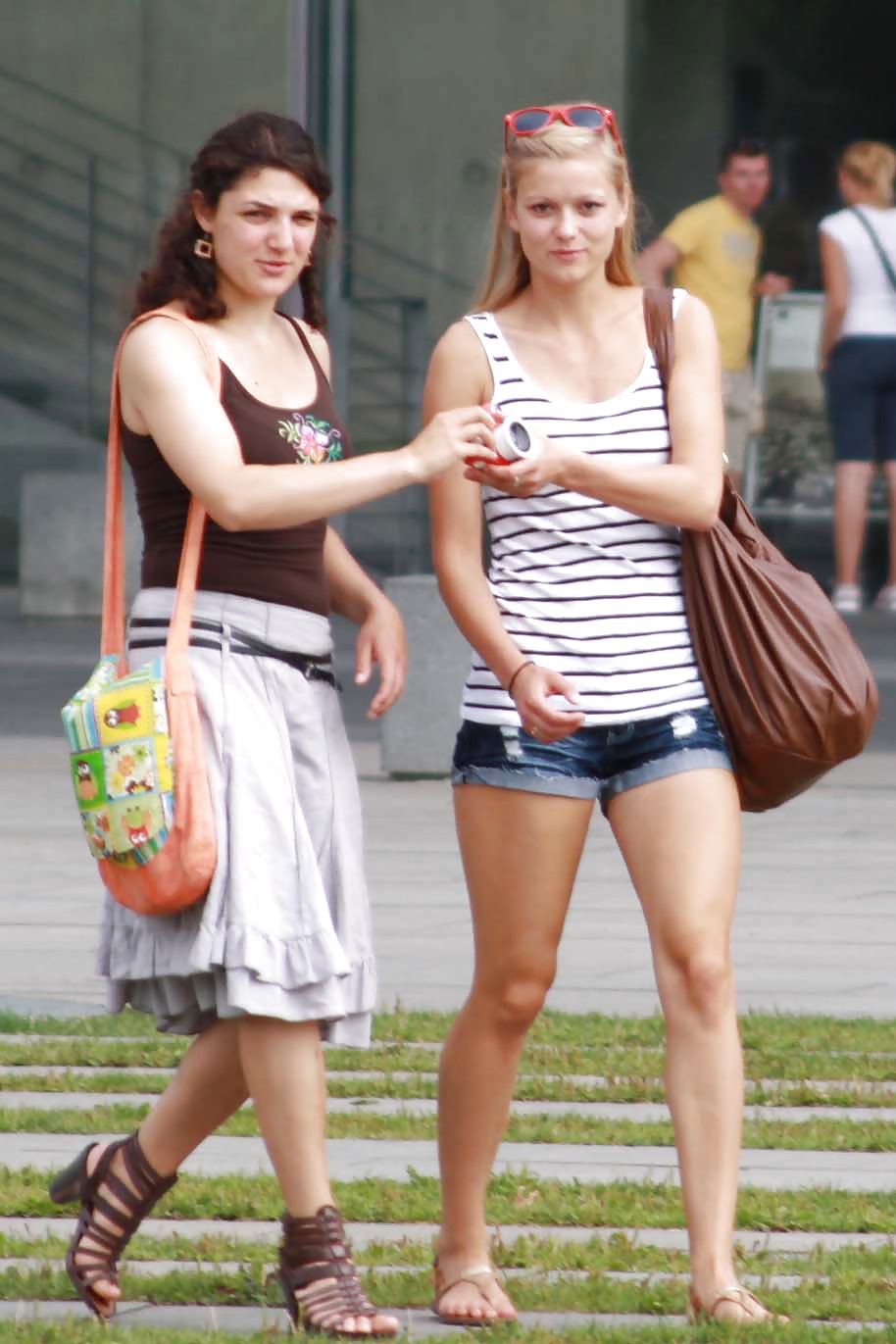 Two sexy and young girls takes photos on a fountain #11126480