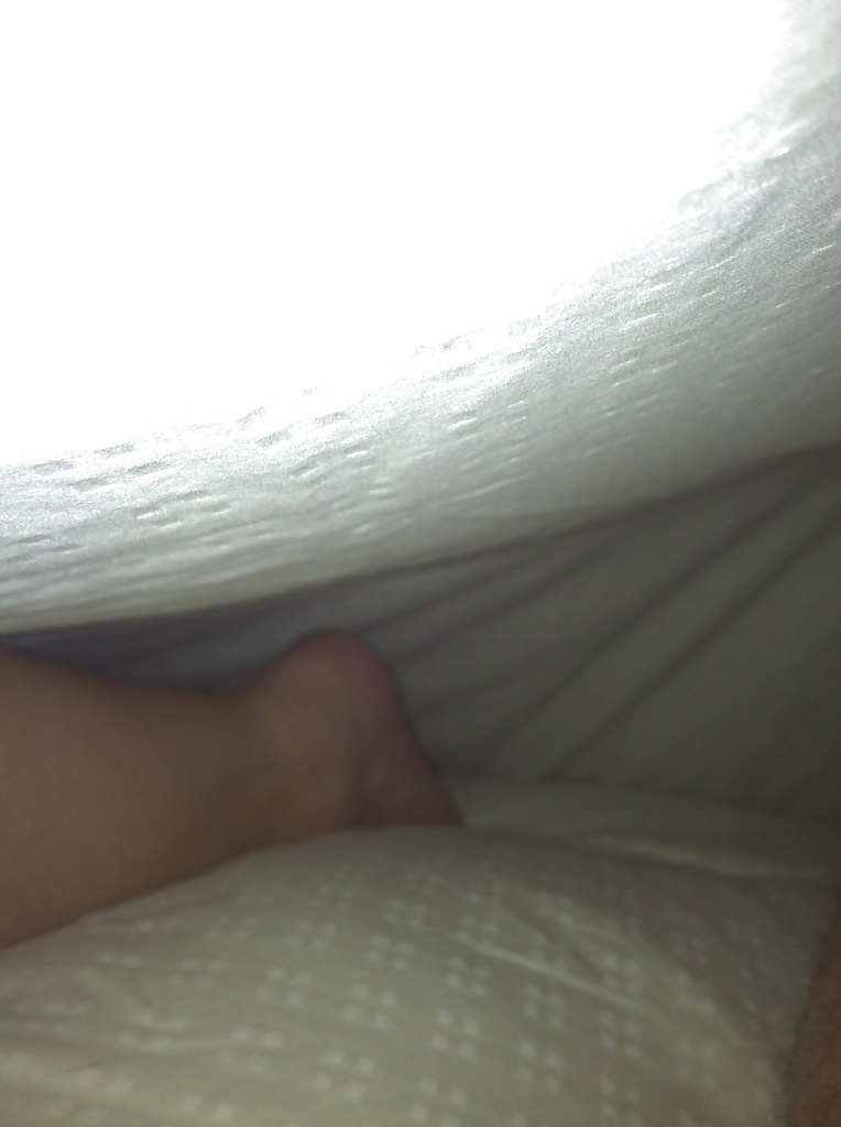 Wife's feet under the covers #19321444