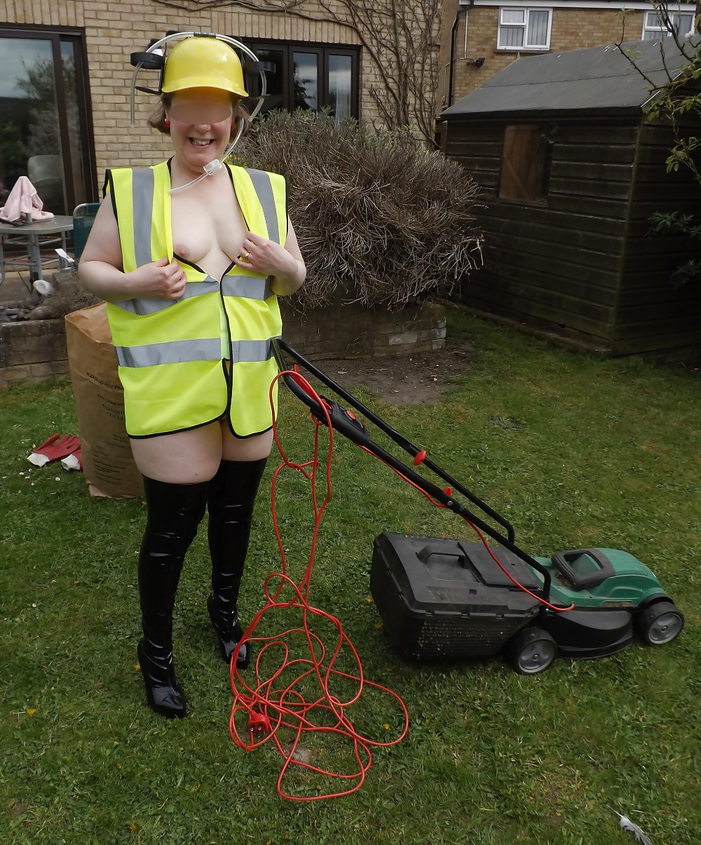Mowing the lawn in PVC thigh boots #18903390