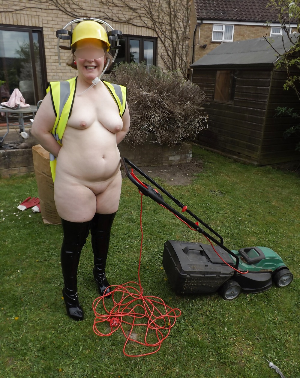 Mowing the lawn in PVC thigh boots #18903397
