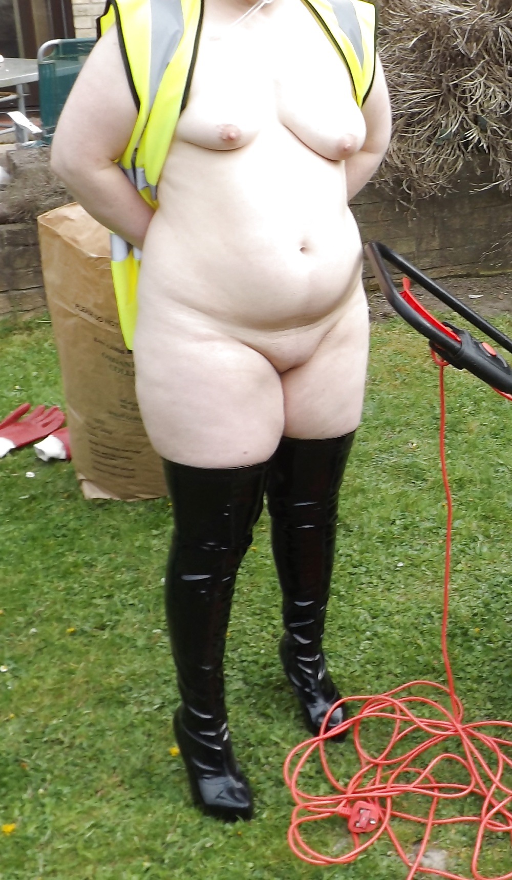 Mowing the lawn in PVC thigh boots #18903406