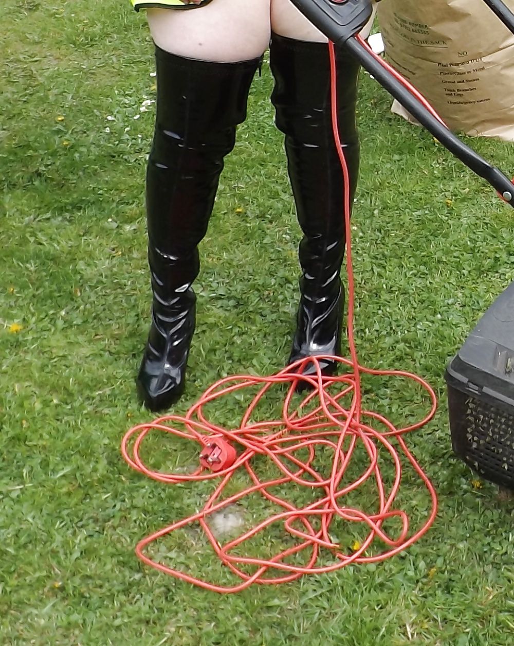 Mowing the lawn in PVC thigh boots #18903418
