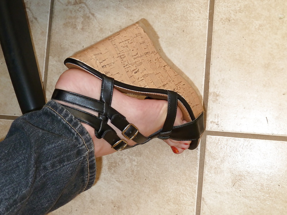 Girls feet in wedges heels #9375298