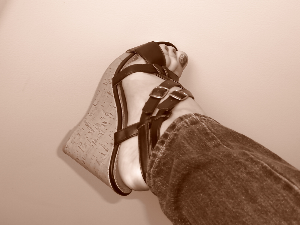Girls feet in wedges heels #9375426