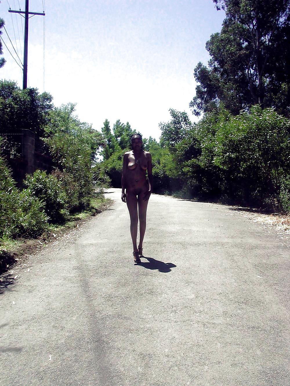 Ebony cutie posing nude outdoors and in public
