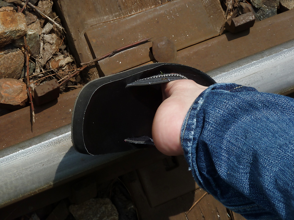Feet on rails train #21082329