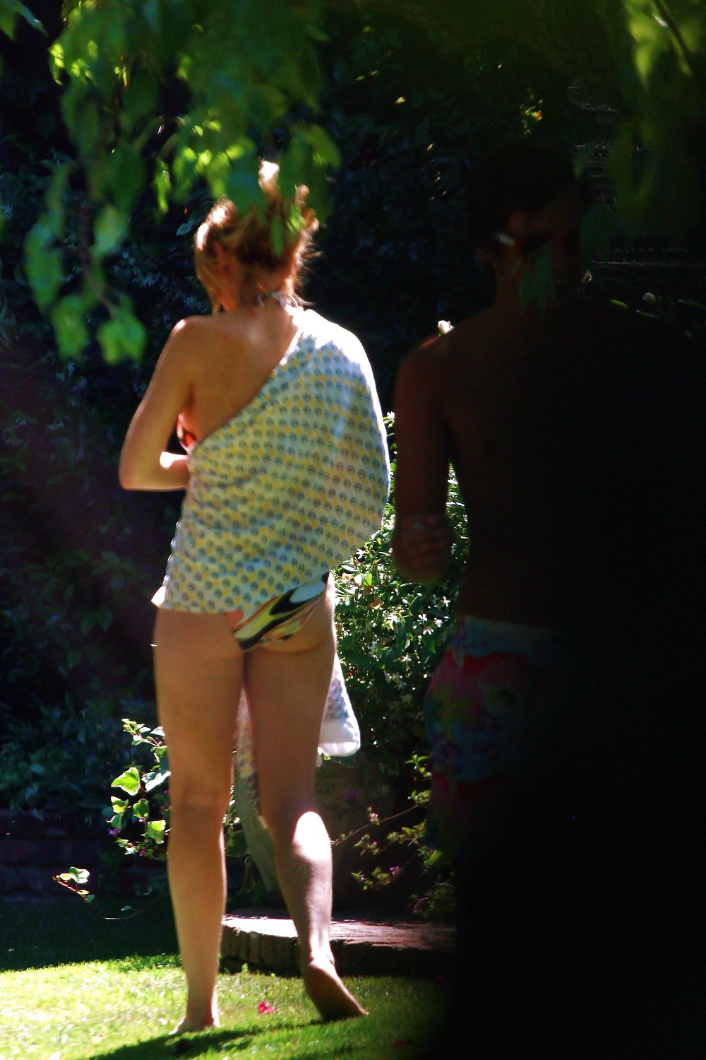 Lindsay Lohan strolling around a park in a Bikini