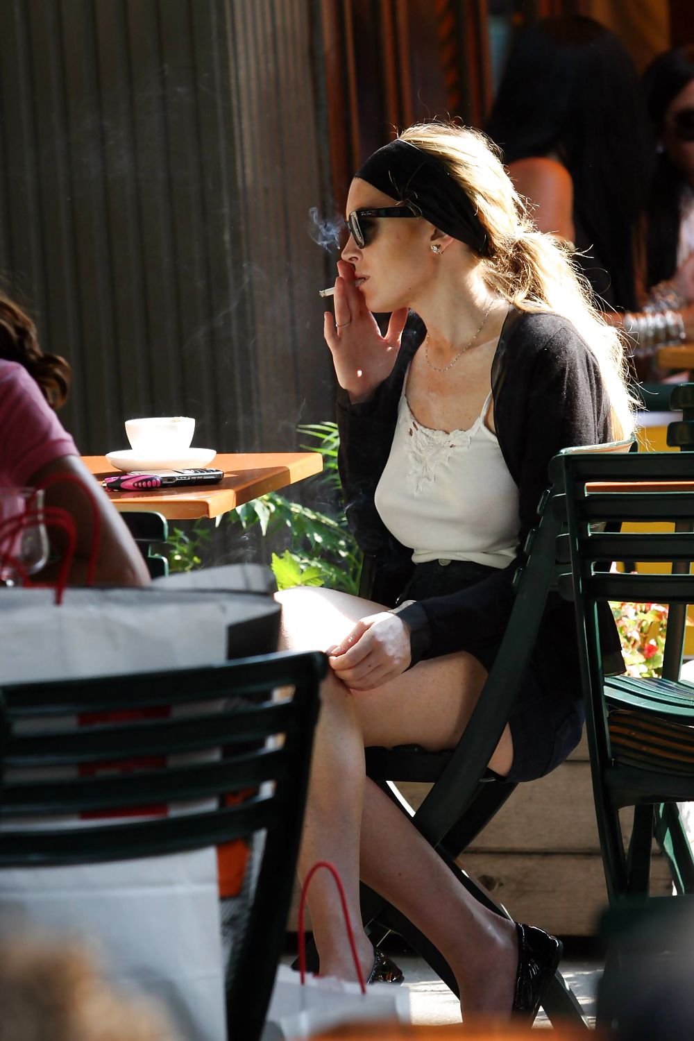 Lindsay Lohan is leggy smoking a cigarette in denim shorts #3647024