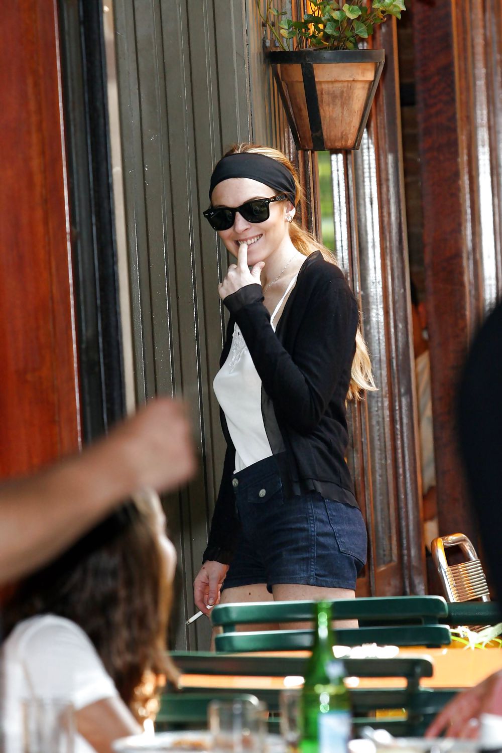 Lindsay Lohan is leggy smoking a cigarette in denim shorts #3647085
