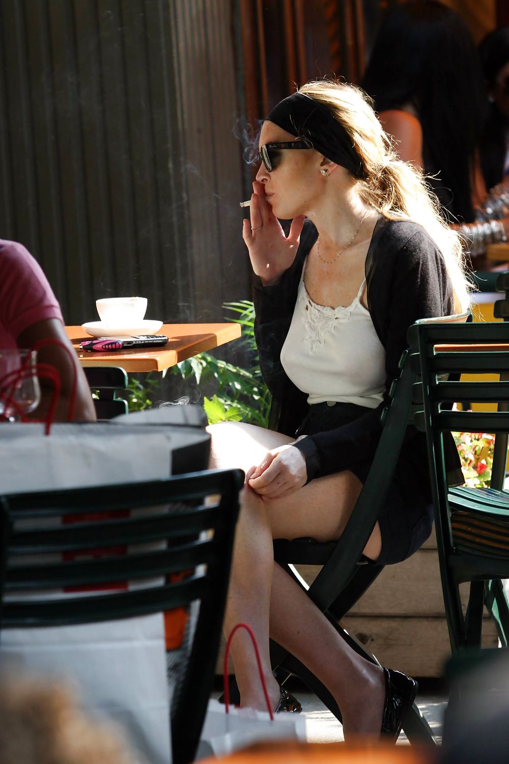 Lindsay Lohan is leggy smoking a cigarette in denim shorts #3647093