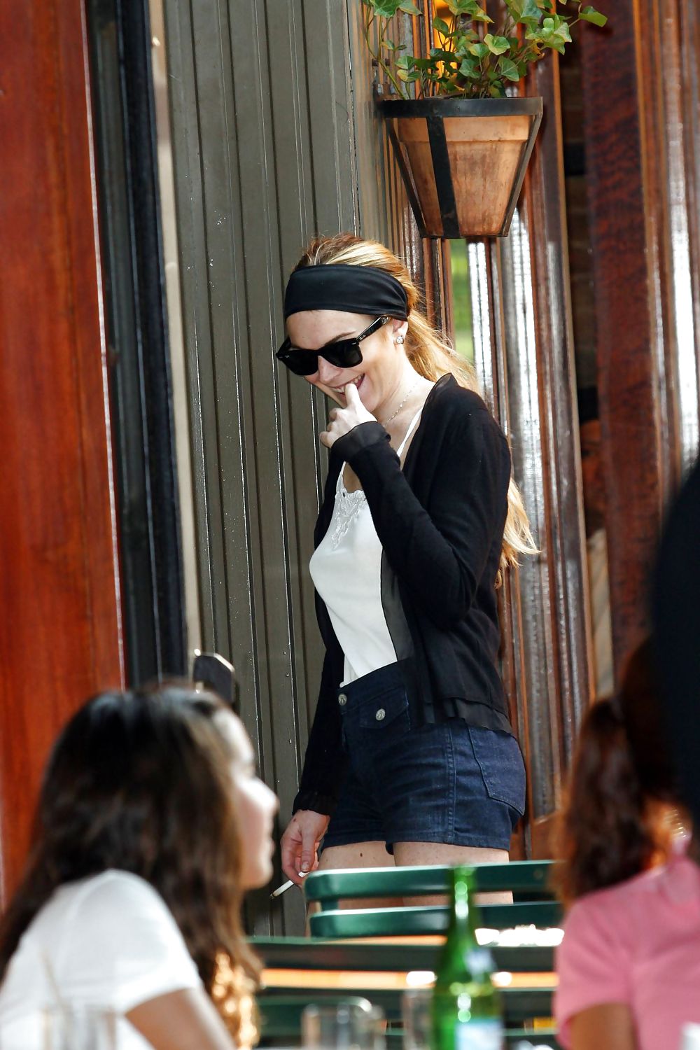 Lindsay Lohan is leggy smoking a cigarette in denim shorts #3647115