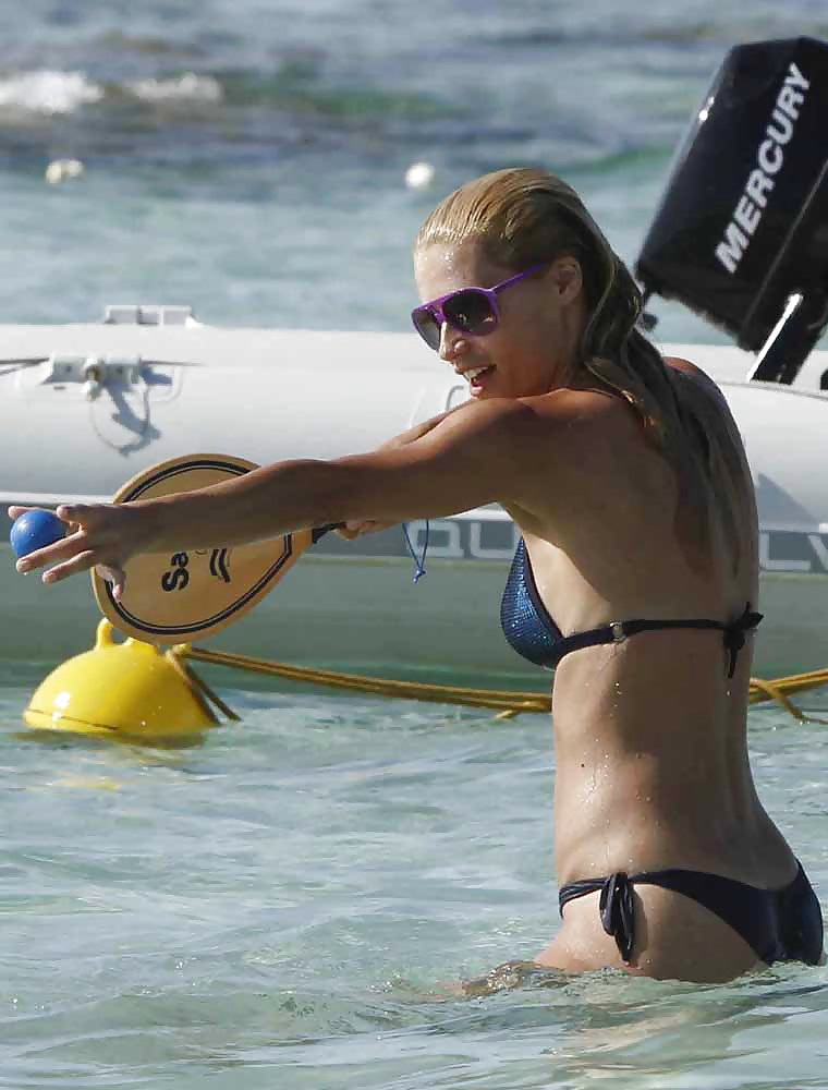 Michelle Hunziker carrying a bikini in Formentera, Spain ASS