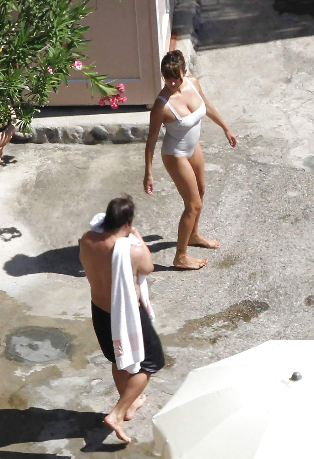 Penelope Cruz relaxing by the pool in a swimsuit #7586446