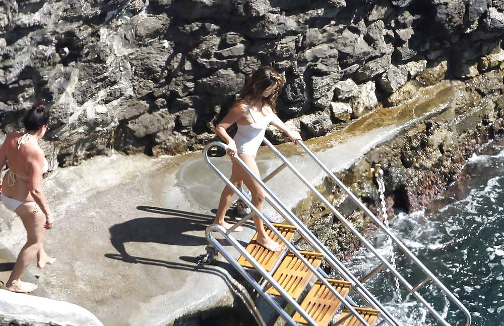 Penelope Cruz relaxing by the pool in a swimsuit #7586510