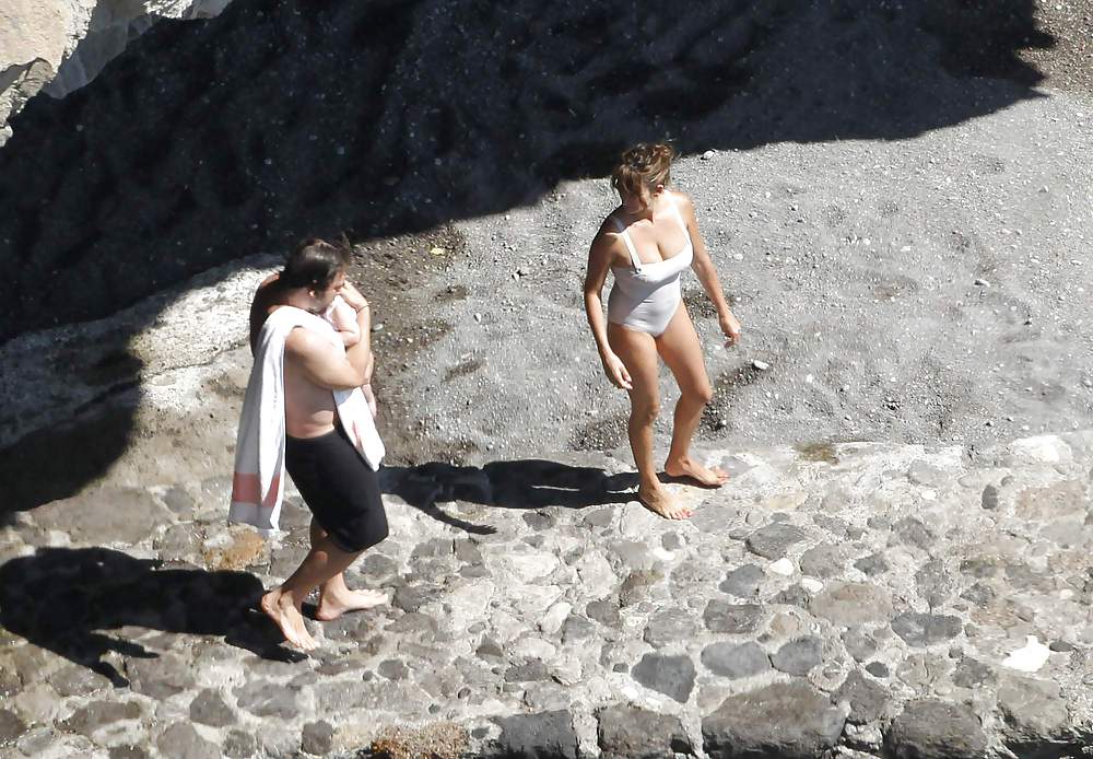 Penelope Cruz relaxing by the pool in a swimsuit #7586518