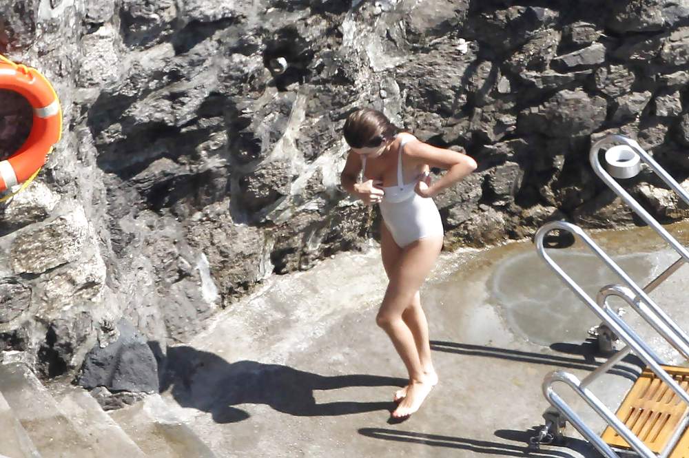 Penelope Cruz relaxing by the pool in a swimsuit #7586525