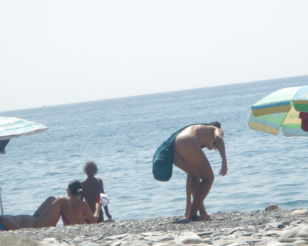 Beach stripping Getting nude at beach Undressing beach #18202174