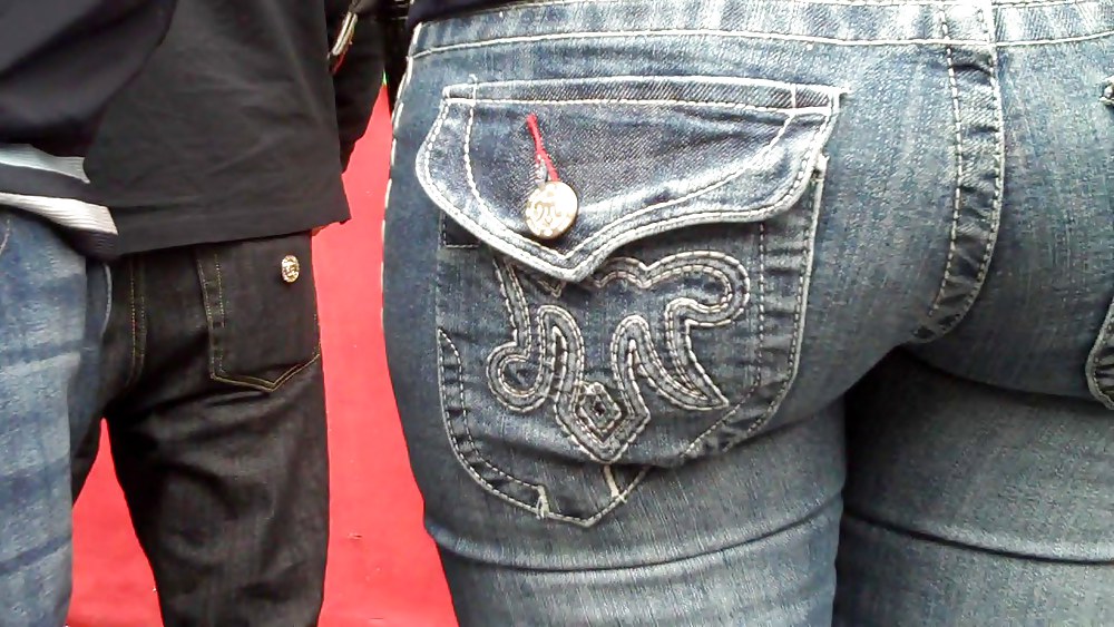 Rear view of butts and ass in jeans