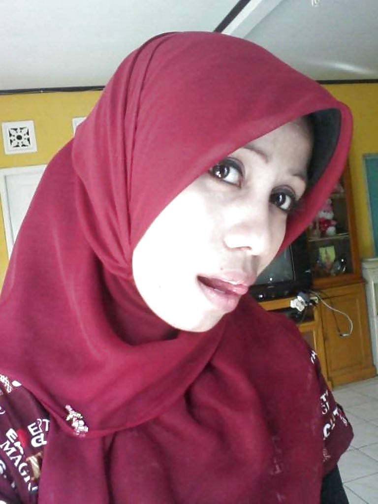 Malay wife with kain batik and hijab #9225844