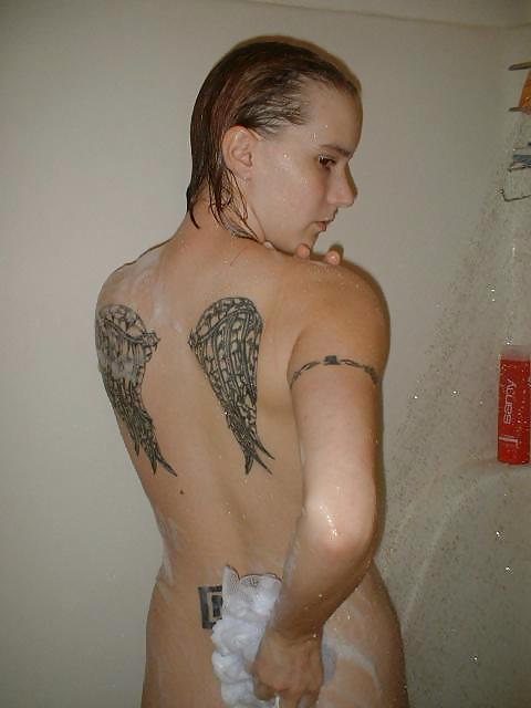 Tattoo girl showering
 #12508132