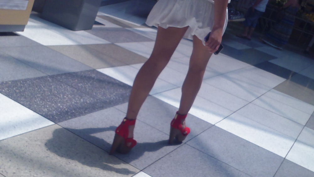 Cute girls ass & butt in short white mini skirt & red shoes #12647513
