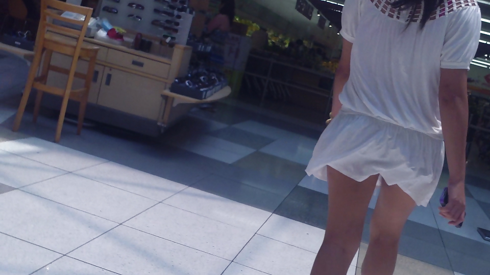 Cute girls ass & butt in short white mini skirt & red shoes #12647535